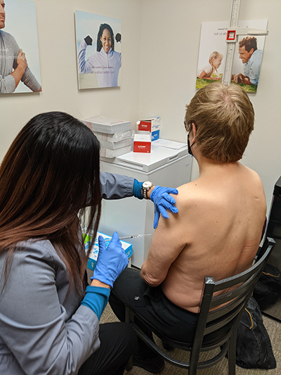 M.A.C. receiving the COVID vaccine.