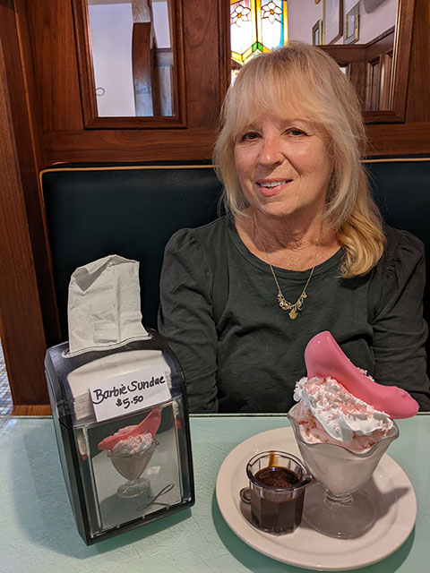 Barb Collins celebrates Barbenheimer with a Barbie sundae at Lagomarcino’s in the Village of East Davenport