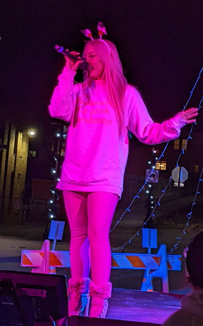 Alisabeth Von Presley performing at the 2024 Muscatine holiday stroll.